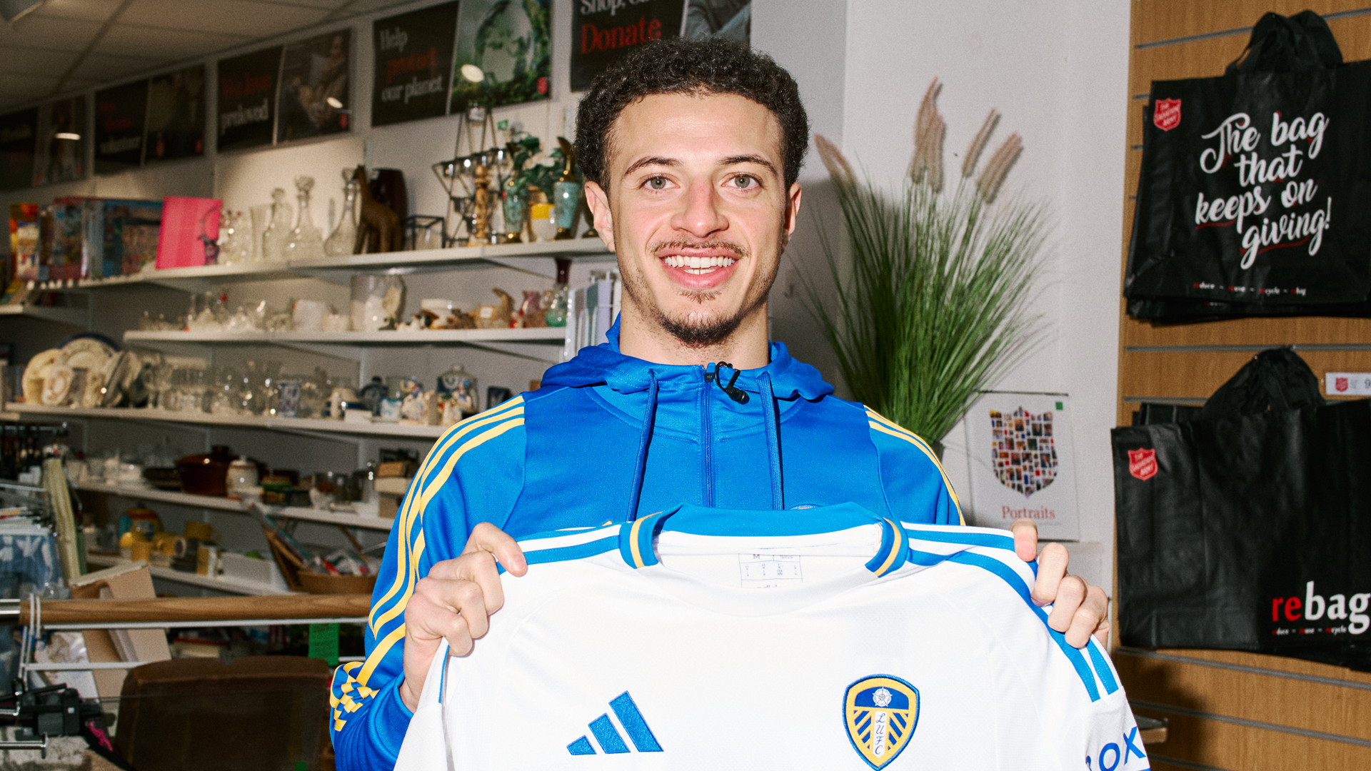 Ethan Ampadu dropping off shirt at Charity shop in Leeds